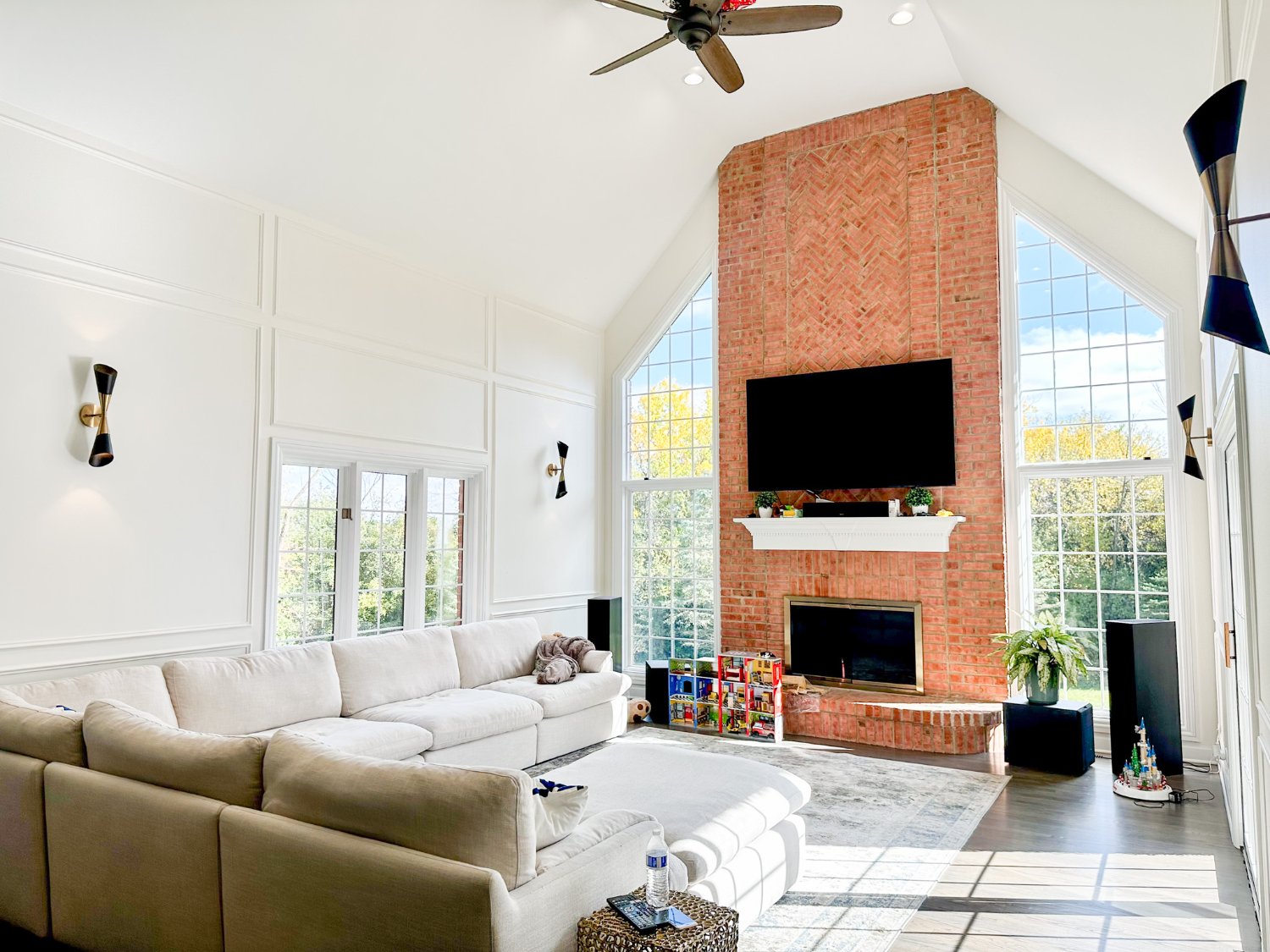 remodeled great room with brick fireplace, vaulted ceilings, and oversized windows by Skor Construction in Barrington, IL.-optimized