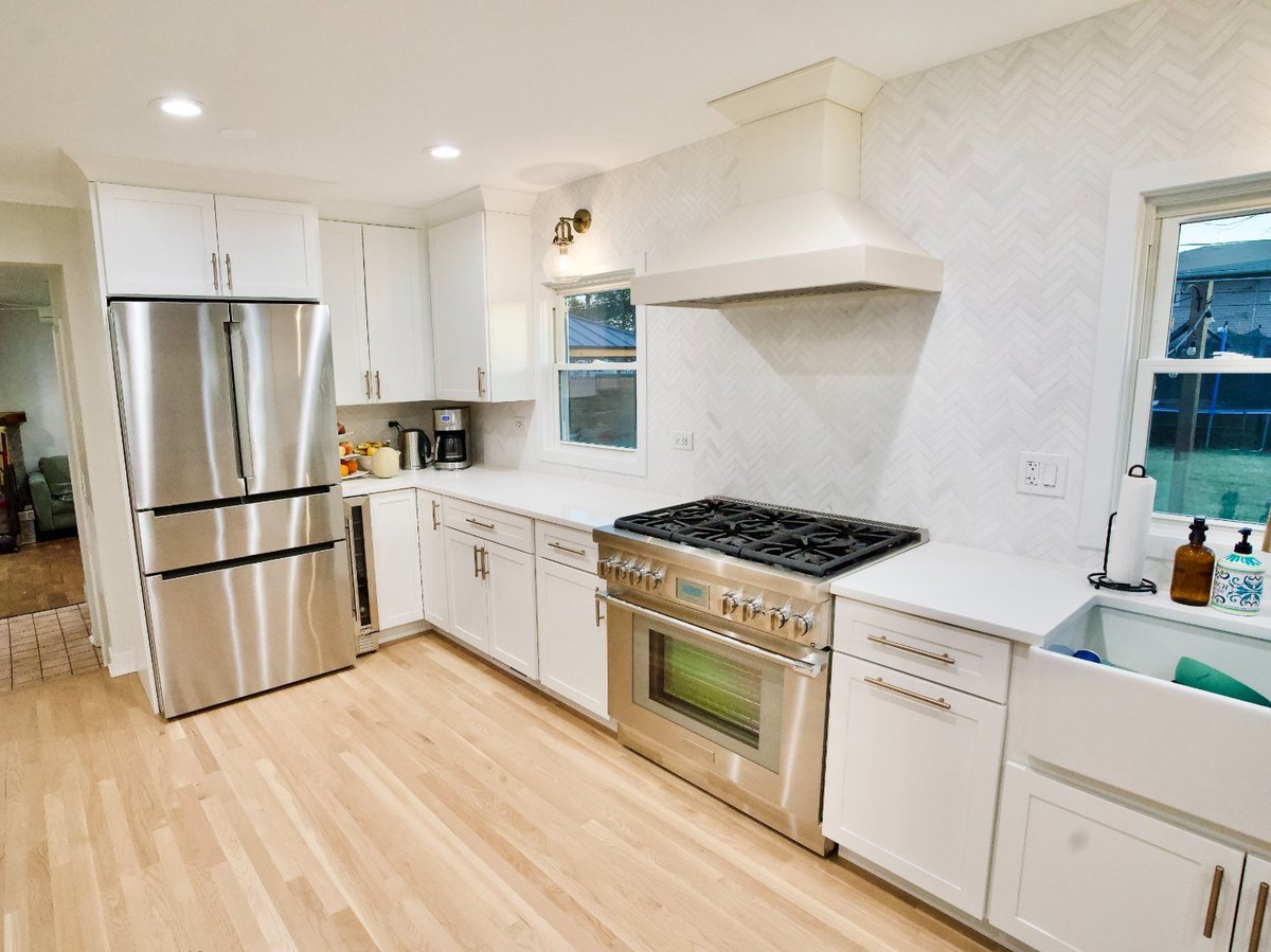 modern kitchen remodel with farmhouse sink, white cabinetry, and designer backsplash by Skor Construction in Mount Prospect, IL.-optimized