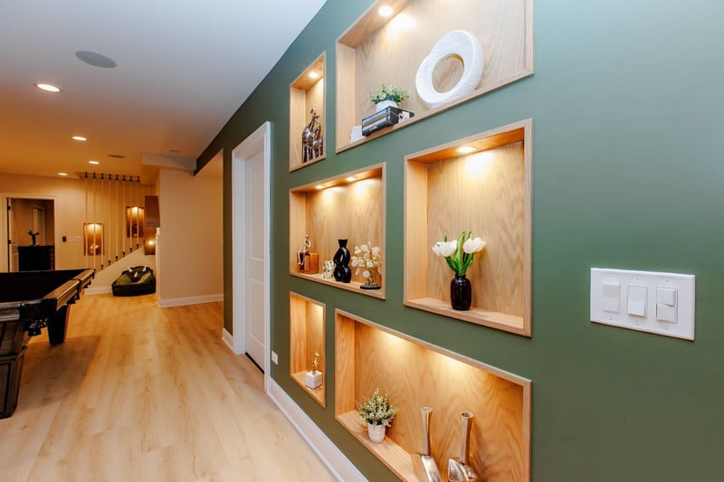 finished basement hallway with built-in shelving, recessed lighting, and modern design details by Skor Construction in Palatine,-optimized