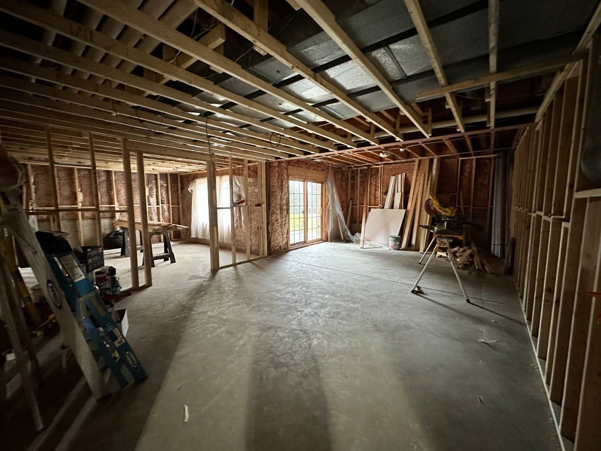 unfinished basement renovation featuring new wall framing and future entertainment space construction by Skor Construction in Pa-optimized