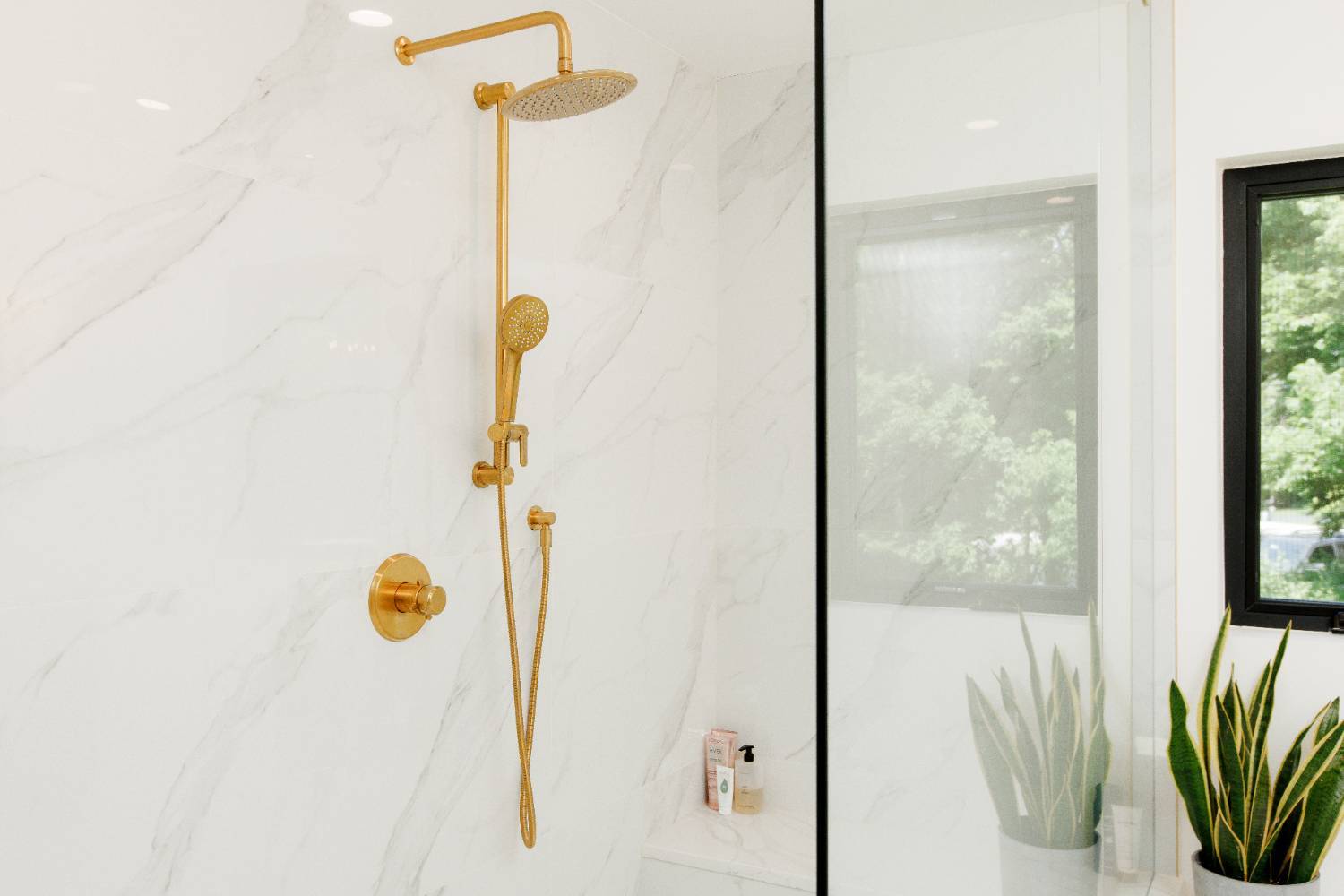 Custom walk-in shower with gold fixtures completed by Skor Construction in a Palatine, IL home addition.-optimized Custom walk-in shower with gold fixtures completed by Skor Construction in a Palatine, IL home addition.-optimized