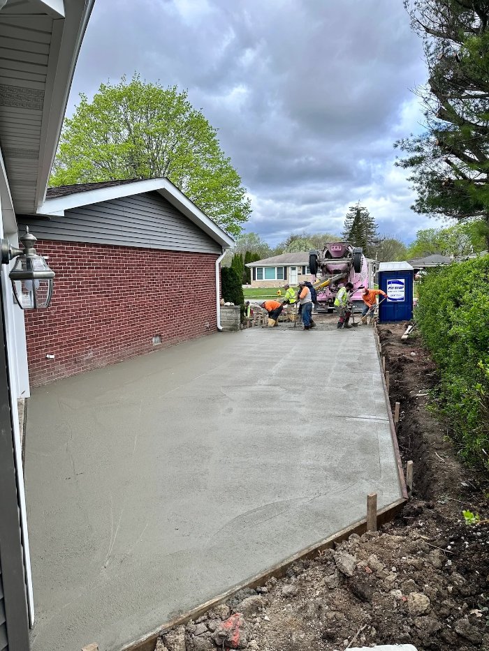 concrete driveway installation for a home addition project by Skor Construction in Mount Prospect, IL during site construction.-optimized