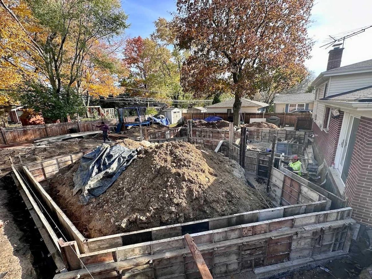 early-stage home addition construction by Skor Construction in Mount Prospect, IL featuring foundation preparation and site work-optimized