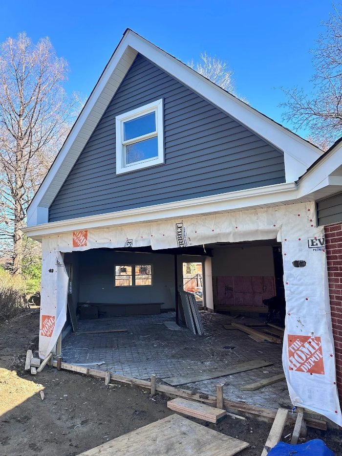 garage addition under construction by Skor Construction in Mount Prospect, IL featuring new framing, siding, and exterior buildi-optimized