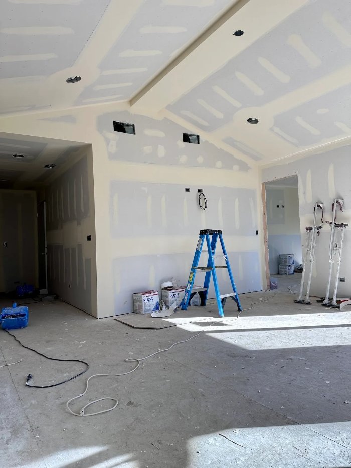 new living space within a home addition project by Skor Construction in Mount Prospect, IL during drywall finishing stages.-optimized