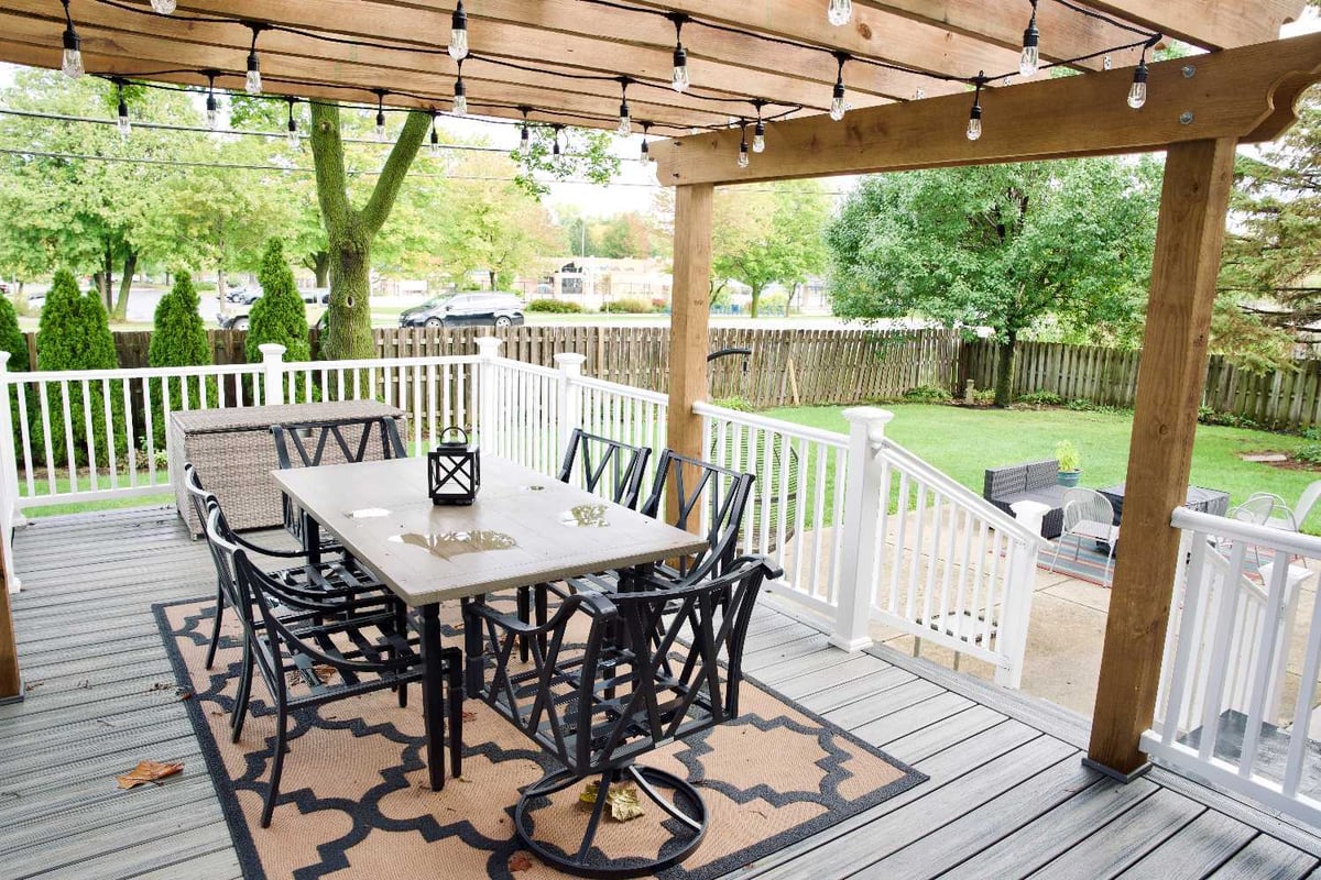 backyard pergola project by Skor Construction in Mount Prospect, IL with covered outdoor seating and elevated deck space.-optimized