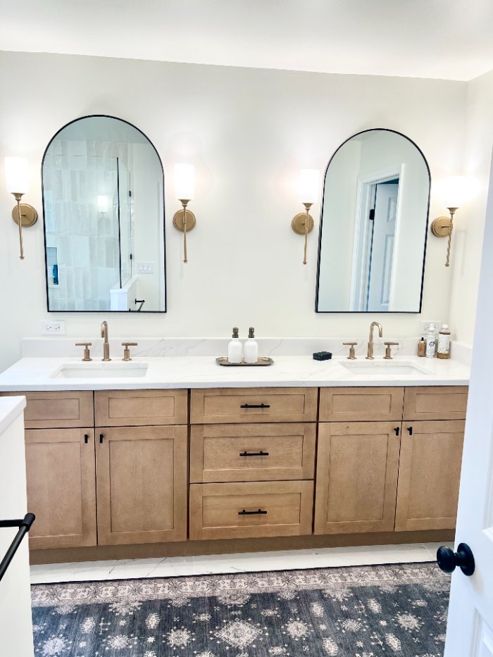 bathroom remodel by Skor Construction in Palatine, IL featuring a custom double vanity with quartz countertops, arched mirrors, -optimized