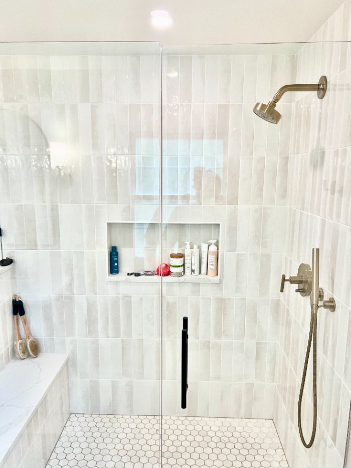 custom walk-in shower by Skor Construction in Palatine, IL featuring a frameless glass enclosure, built-in bench, and recessed s-optimized