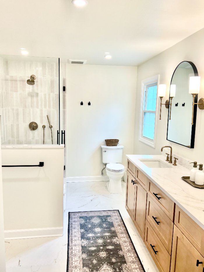 luxury bathroom renovation by Skor Construction in Palatine, IL showcasing quartz countertops, custom cabinetry, and elegant til-optimized