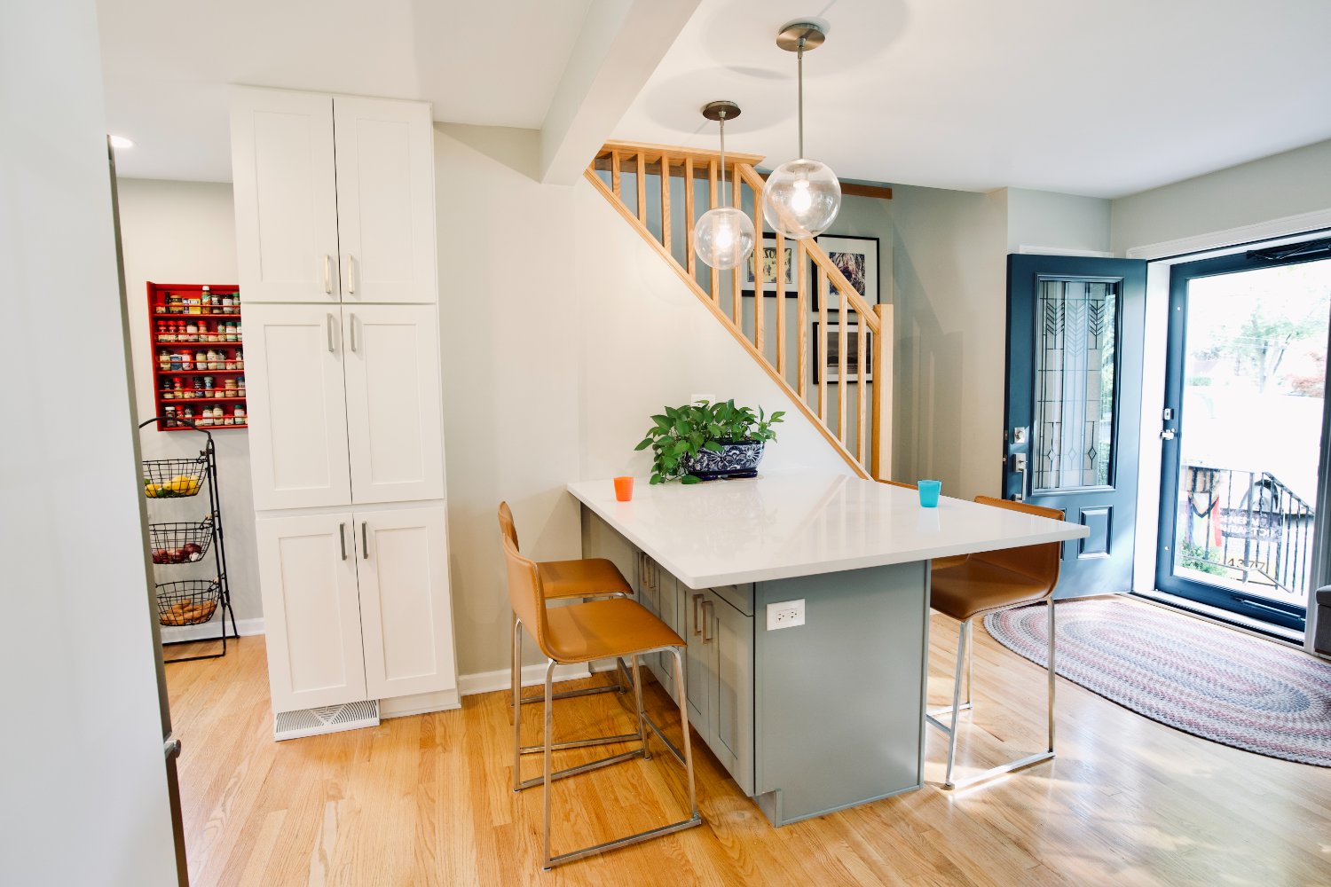 modern kitchen remodel with a large island, custom cabinetry, and pendant lighting by Skor Construction in Mount Prospect, IL.-optimized