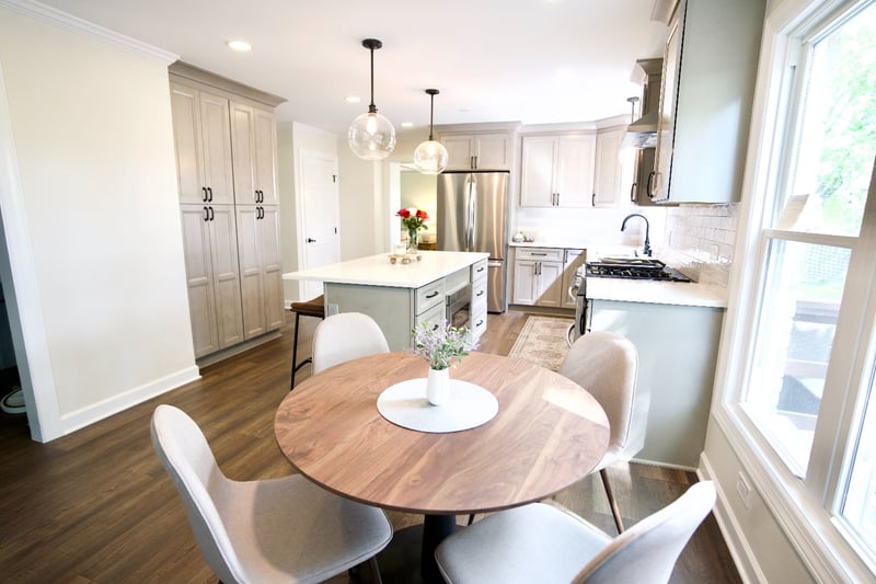 remodeled kitchen with custom cabinetry, quartz countertops, and an adjacent dining area by Skor Construction in Arlington Heigh-optimized