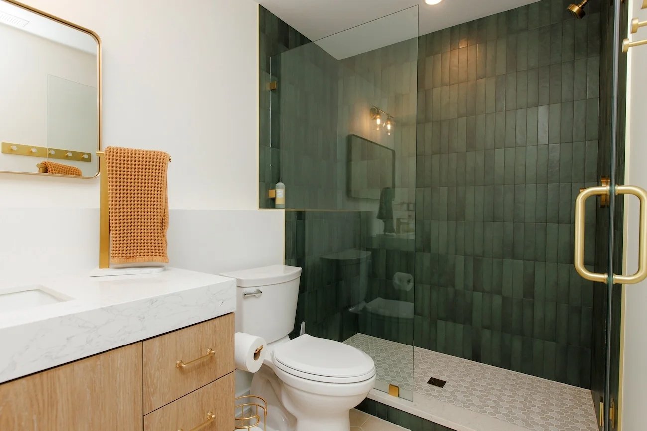 Rich green tile bathroom remodel in Home Addition in Prospect Heights by SKOR Construction-optimized