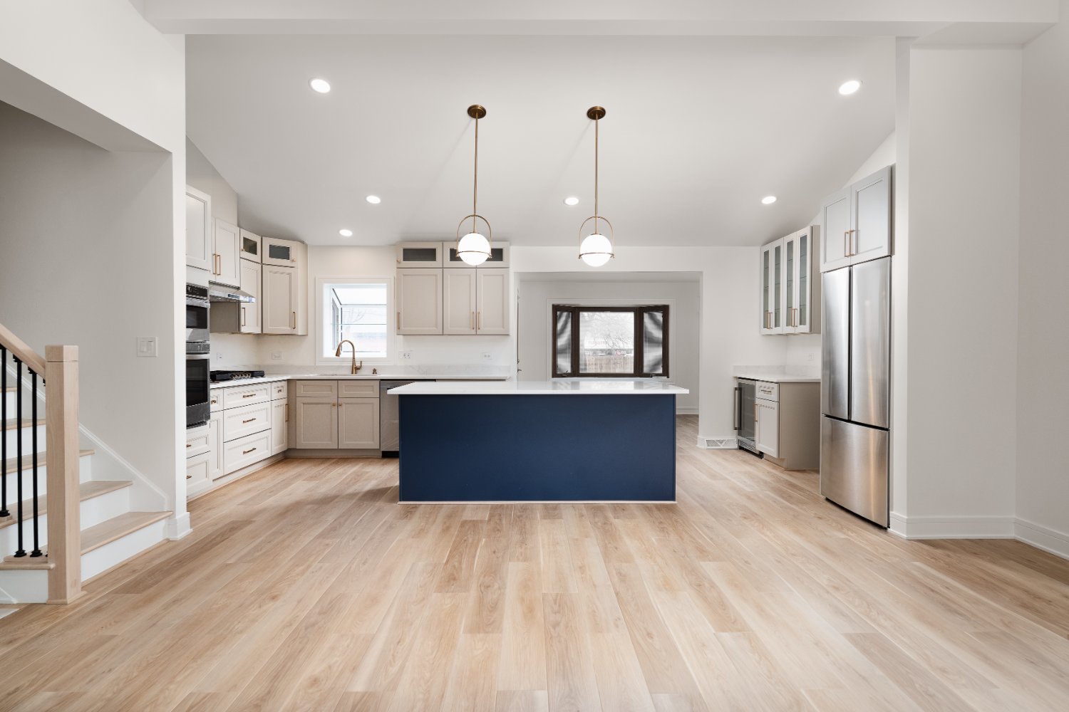 custom cabinetry and a large navy blue kitchen is-optimized