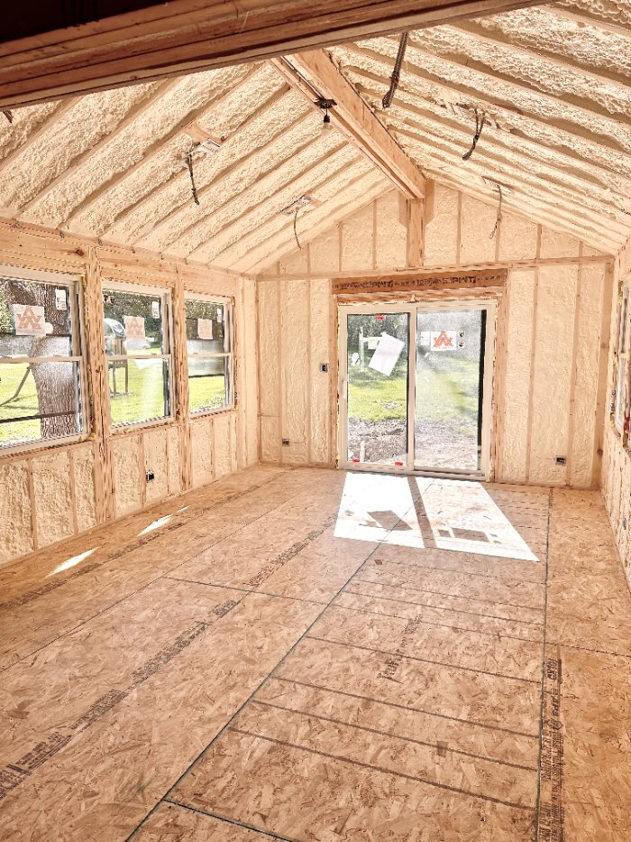 Framed and insulated 3 seasons room addition by Skor Construction in Hawthorn Woods, IL showcasing vaulted ceilings and natural light-optimized