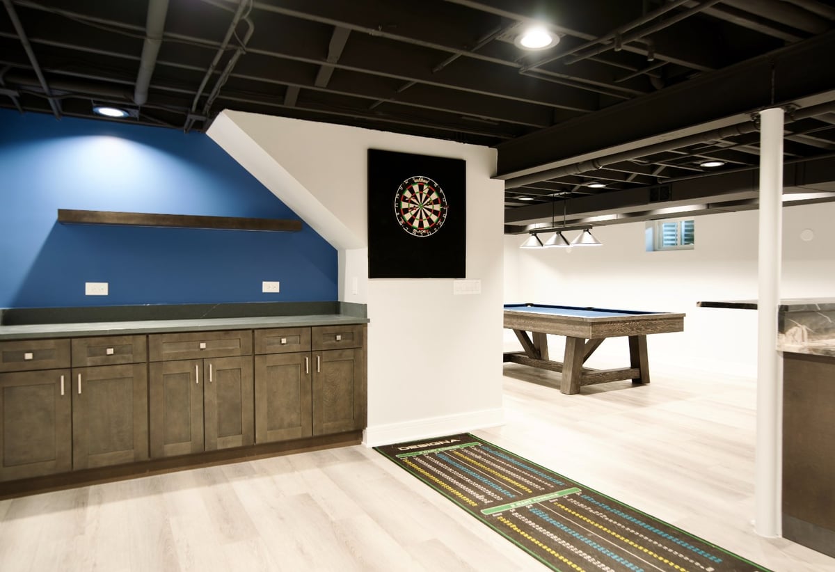 basement entertainment space by Skor Construction in Riverwoods, IL with built-in cabinetry and a billiards table.-optimized