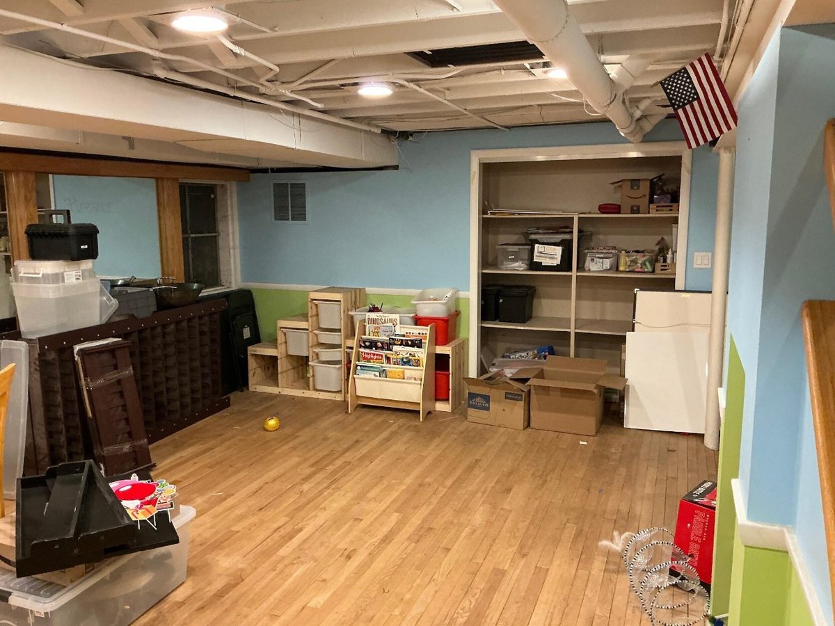 unfinished basement space by Skor Construction in Riverwoods, IL prior to a custom basement remodeling project.-optimized