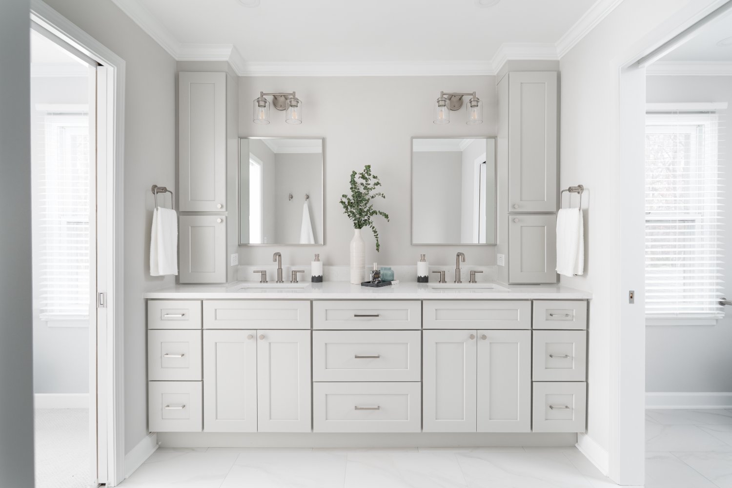 Contemporary Mayland Villa primary bathroom in Lincolnshire, IL showcasing a spacious double vanity and elegant neutral finishes