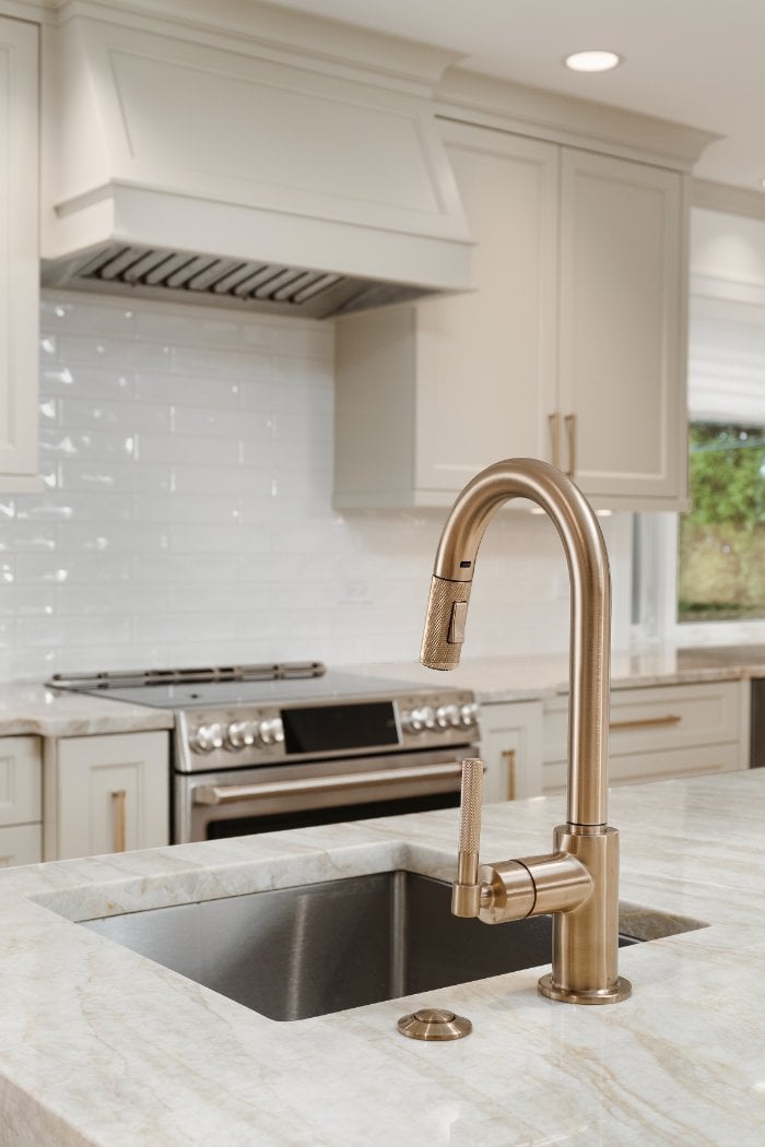 Contemporary kitchen renovation by Skor Construction in Mount Prospect, IL with a deep undermount sink and modern white subway t-optimized
