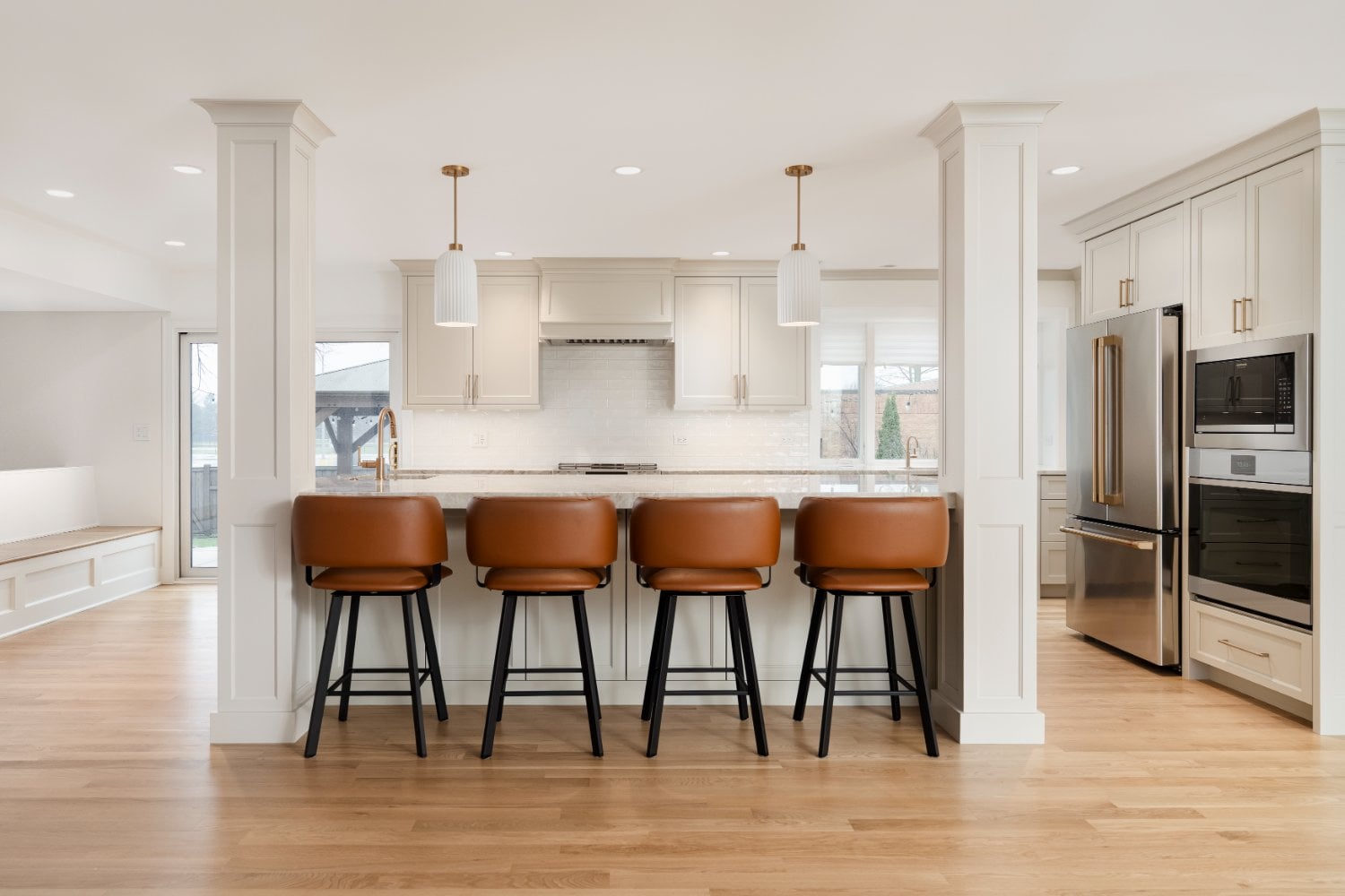 Luxury main level kitchen renovation in Mount Prospect, IL by Skor Construction showcasing quartz countertops, custom millwork, -optimized