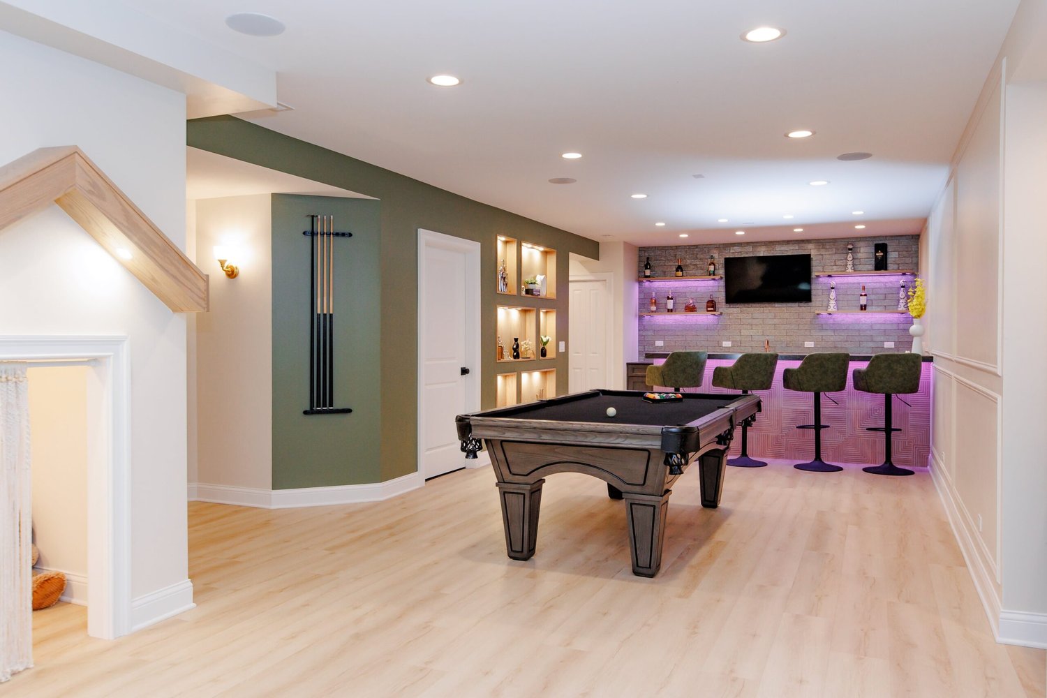 Basement remodel with built in bar, built in custom storage, pool table in North Barrington by Skor Construction