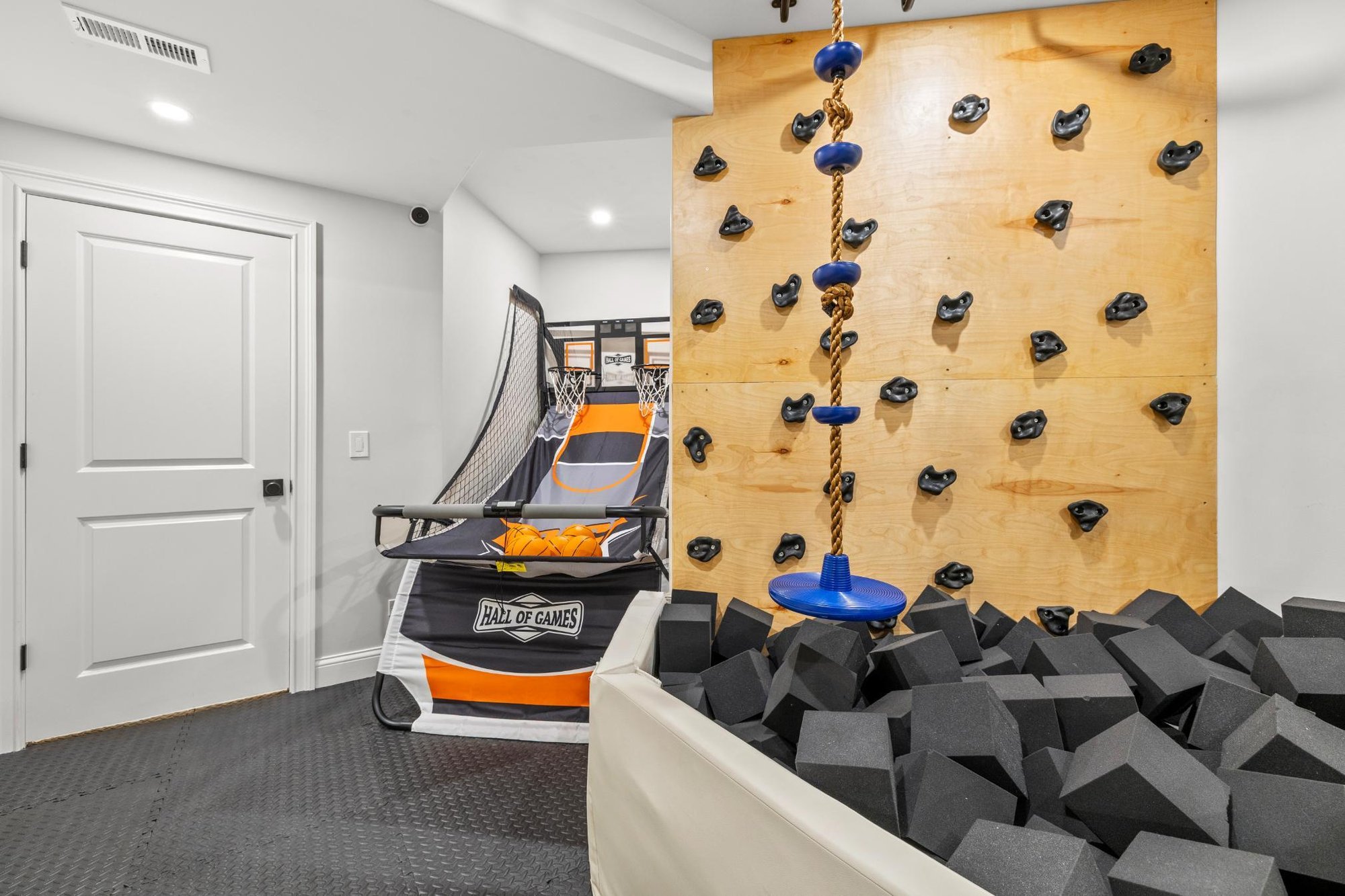 Climbing wall in kids playroom in basement remodel in North Barrington by Skor Remodel Climbing wall in kids playroom in basement remodel in North Barrington by Skor Remodel
