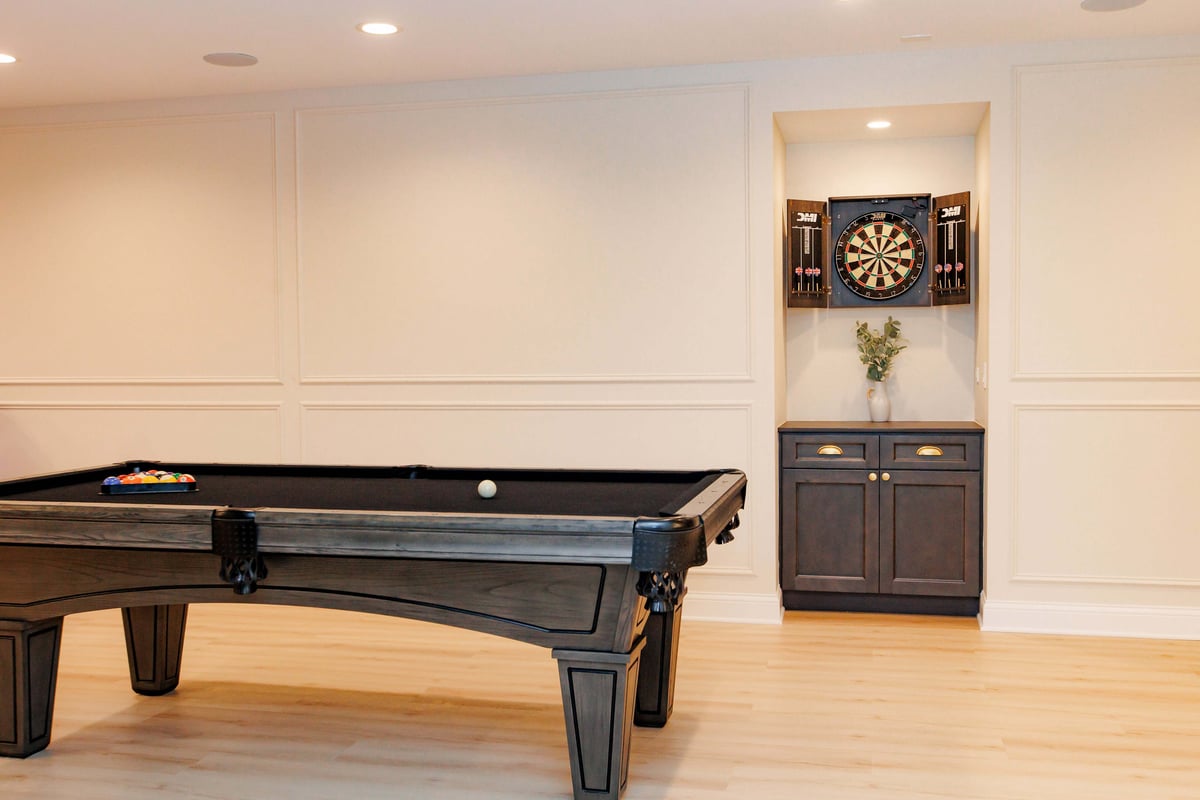 Corner view of billards table and built in storage in basement remodel in North Barrington