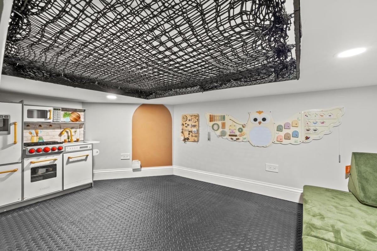 Kids Playroom and Climbing Wall in Basement Remodel in North Barrington by SKOR Construction