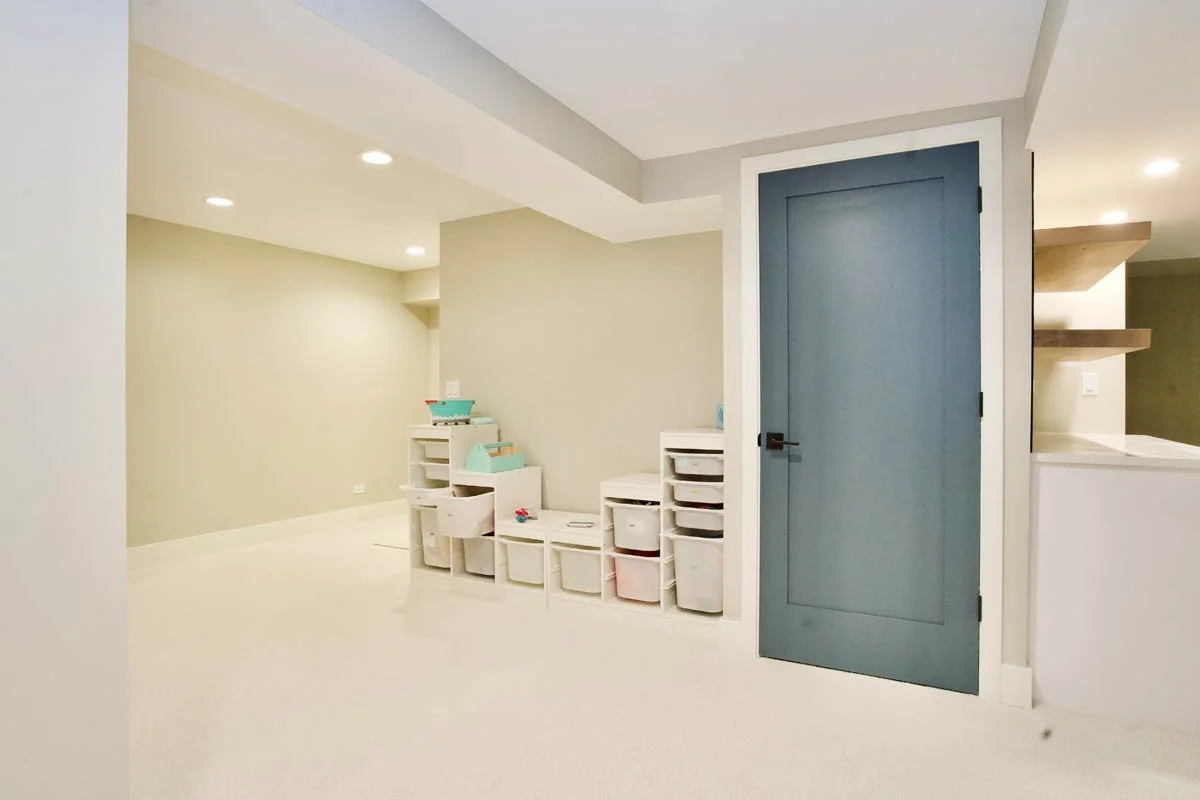 View o finished basement with custom storage and open shelving in Chicago