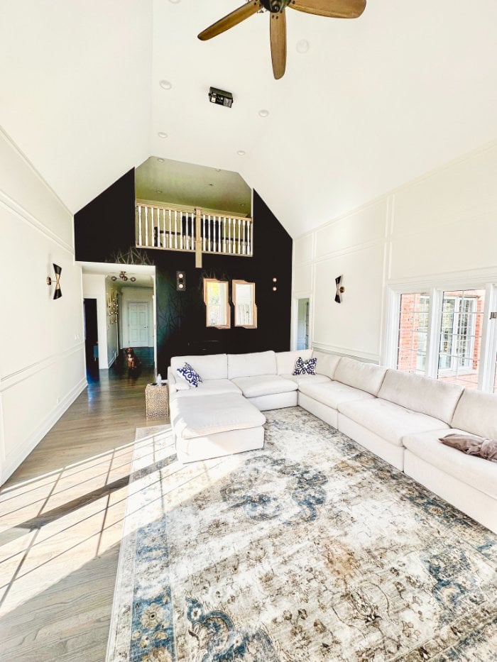 remodeled family room featuring soaring ceilings, custom wall detailing, and abundant natural light by Skor Construction in Barr-optimized