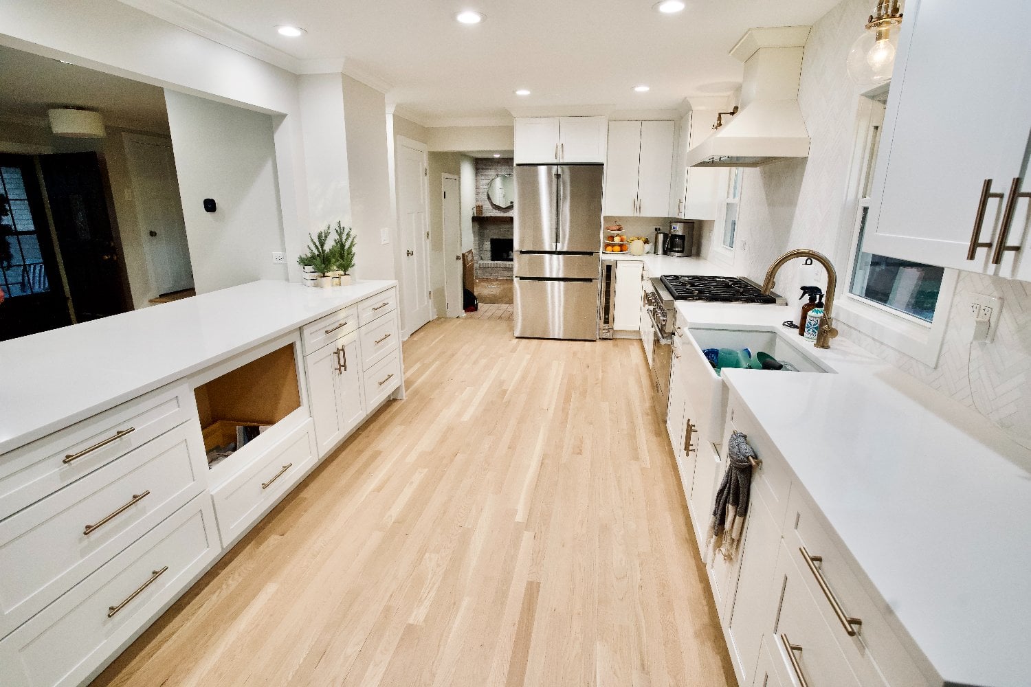 luxury kitchen renovation with custom storage solutions, designer finishes, and bright natural tones by Skor Construction in Mou-optimized
