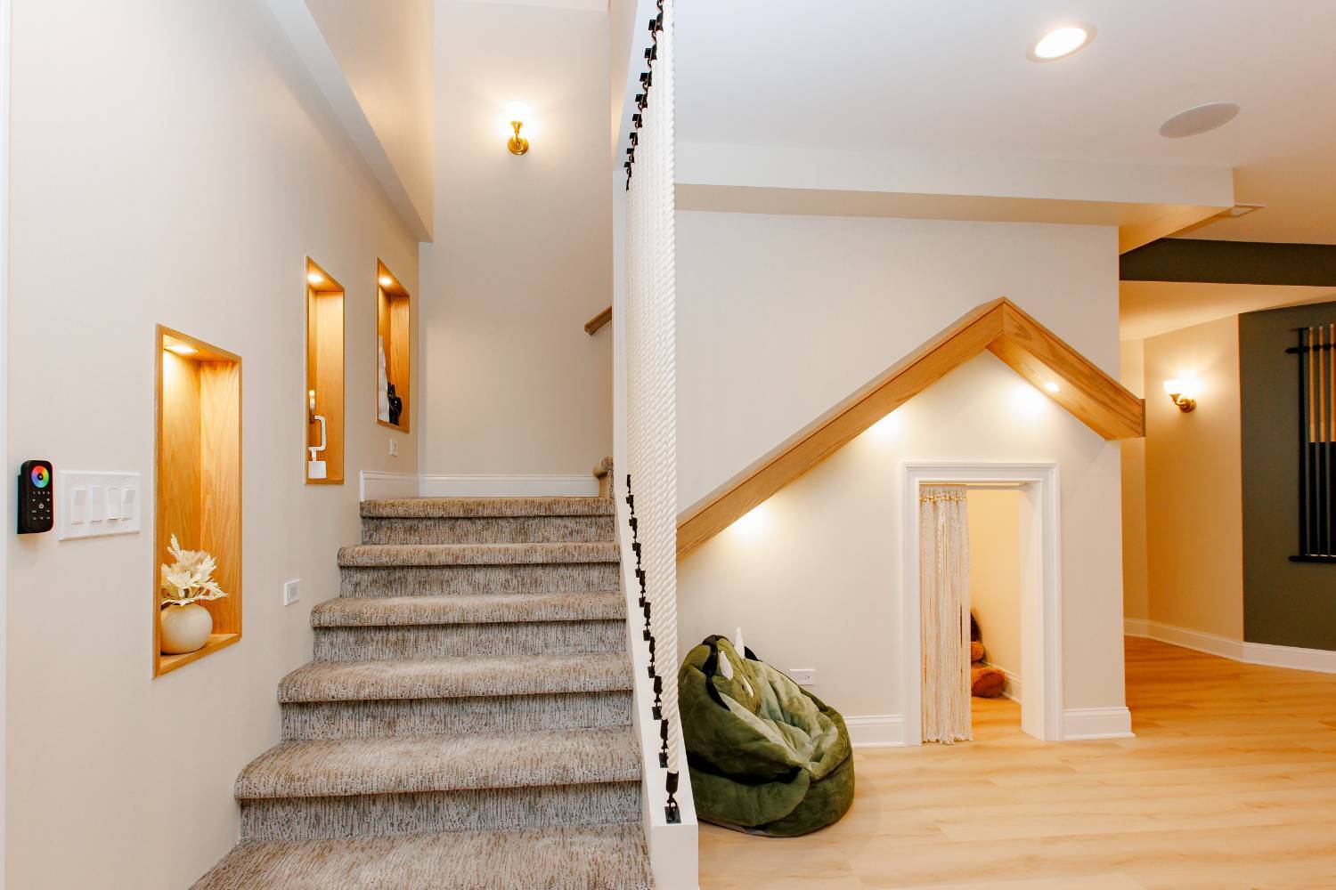 custom basement staircase with integrated lighting, display niches, and modern finishes by Skor Construction in Palatine, IL.-optimized
