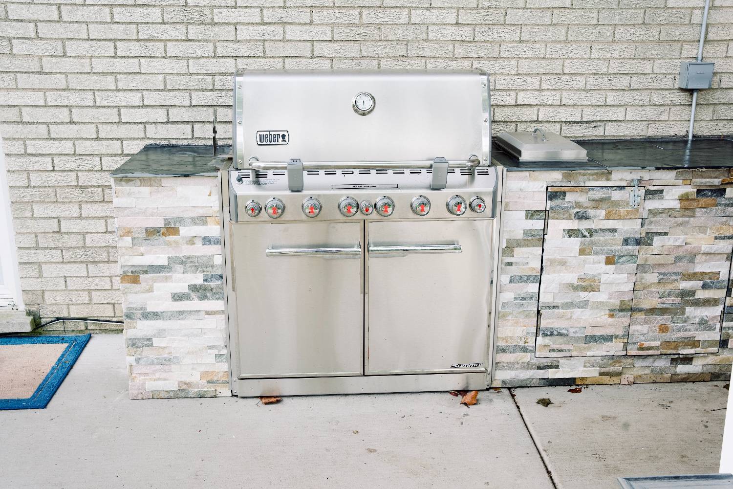 outdoor kitchen installation by Skor Construction in Mount Prospect, IL showcasing premium grilling appliances and stone finishe-optimized