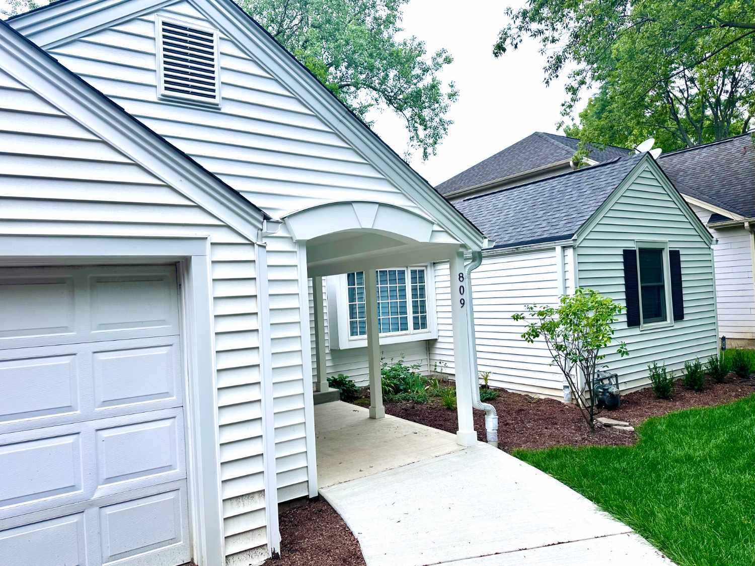 front facade view of a residence in Wilmette, IL prior to a sunroom addition and outdoor living renovation by Skor Construction.-optimized