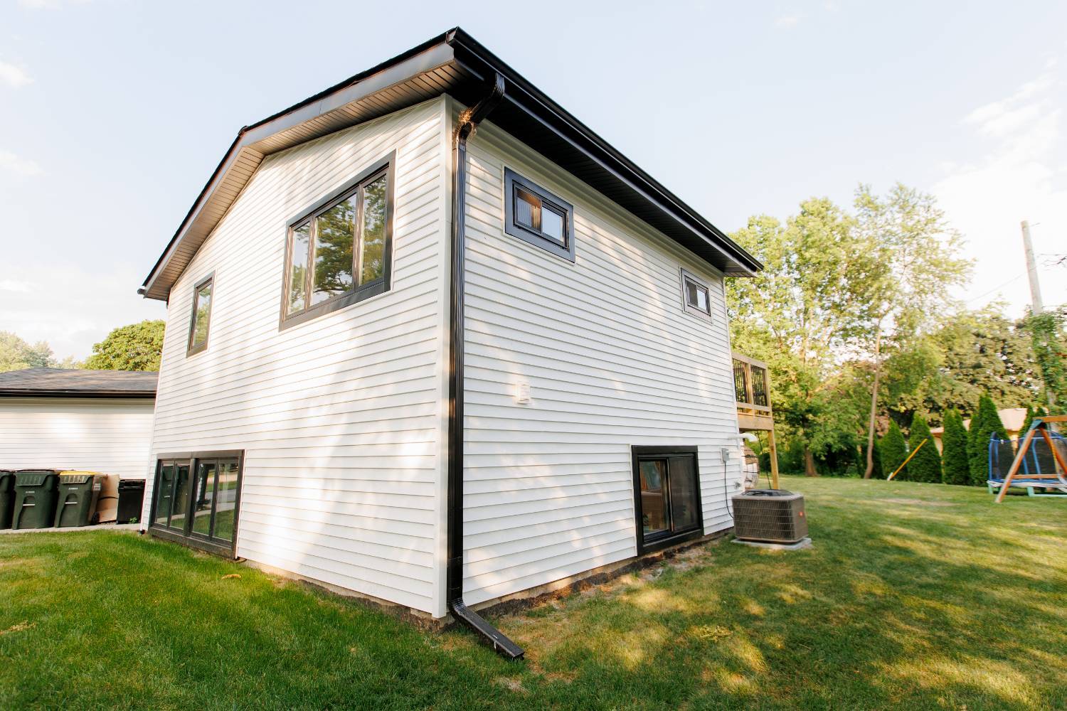 Side exterior of a completed home addition by Skor Construction featuring expanded living space in Palatine, IL.-optimized