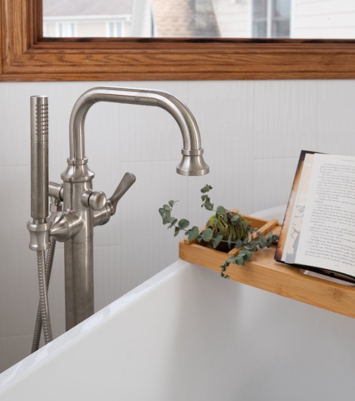 Close-up of a luxury soaking tub area in Inverness, IL remodeled by Skor Construction with modern bath fixtures and wood accents-optimized