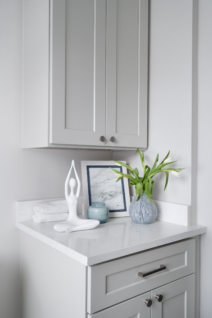 Close-up of Mayland Villa bathroom cabinetry in Lincolnshire, IL with white shaker doors and contemporary styling.-optimized