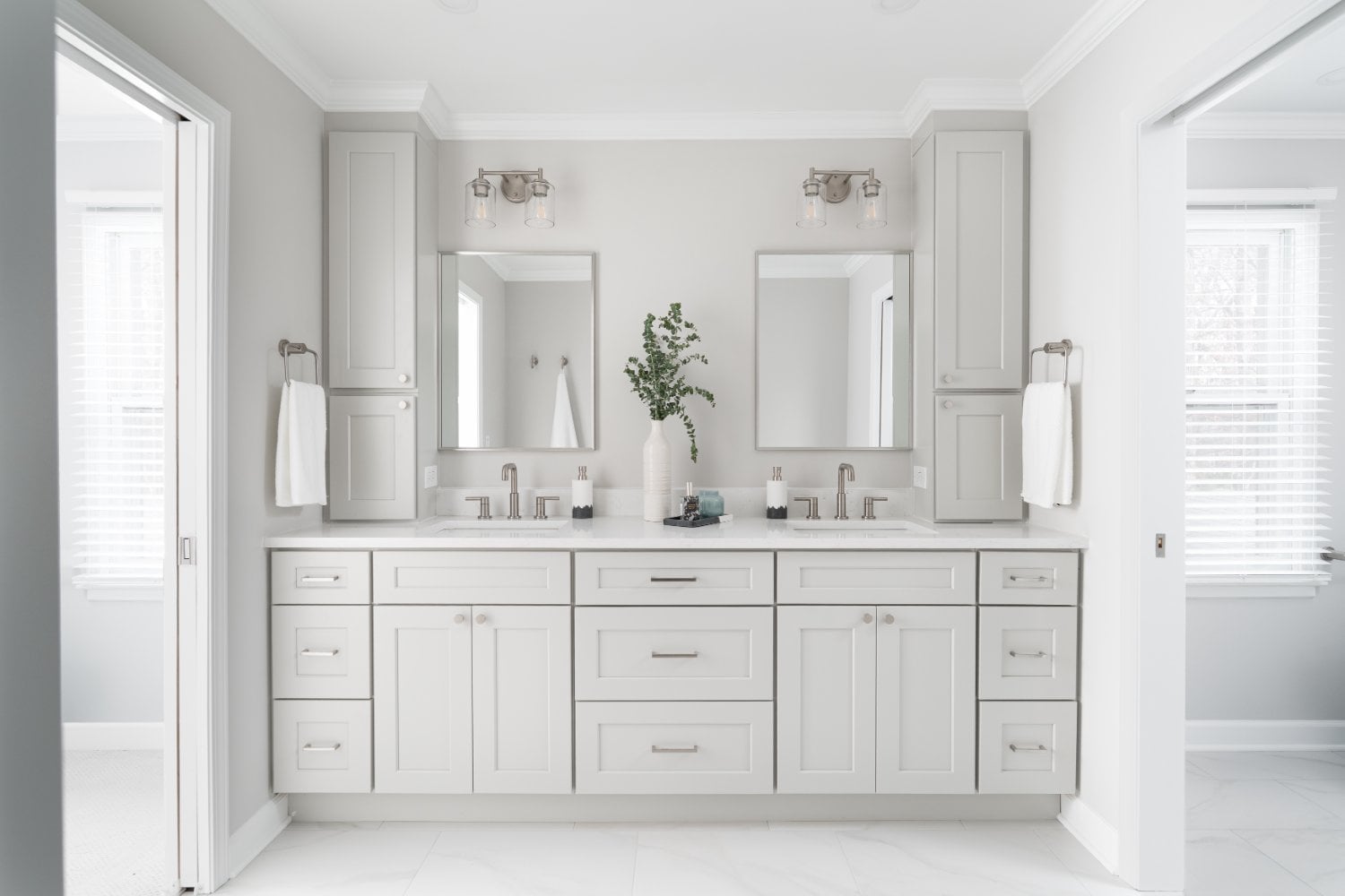 Contemporary Mayland Villa primary bathroom in Lincolnshire, IL showcasing a spacious double vanity and elegant neutral finishes
