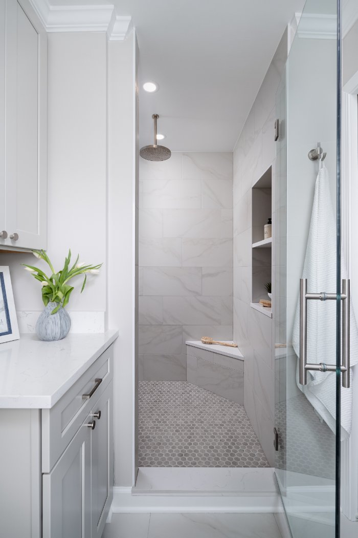 Skor Construction Mayland Villa bathroom remodel in Lincolnshire, IL featuring a frameless glass shower with marble-look tile wa-optimized