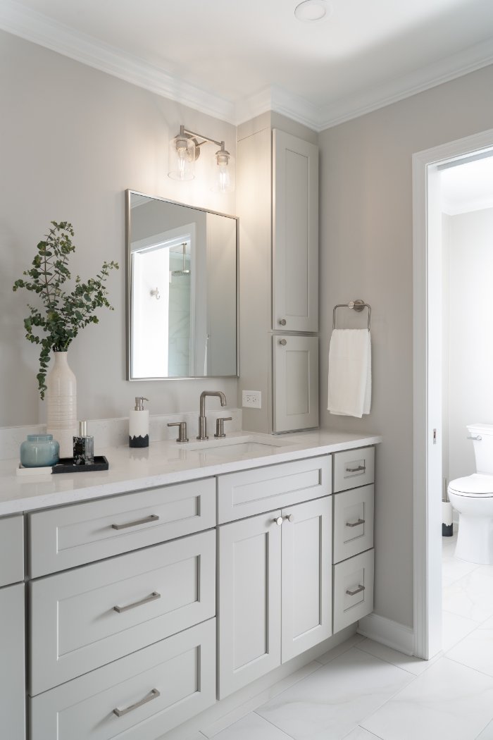 Skor Construction Mayland Villa bathroom remodel in Lincolnshire, IL with illuminated vanity lighting and white shaker cabinetry-optimized