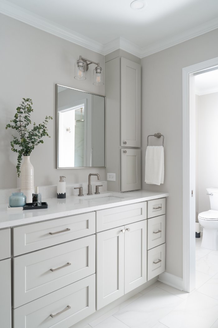 Skor Construction primary bathroom remodel in Lincolnshire, IL featuring a white shaker vanity, quartz countertop, and brushed n-optimized