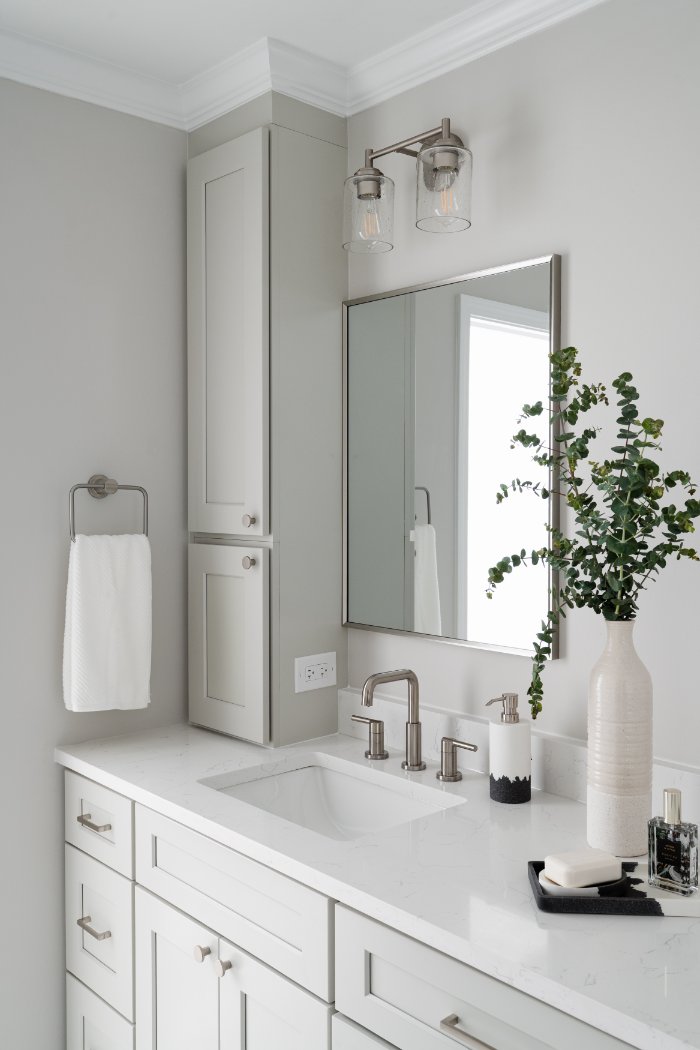 Skor Construction primary bathroom remodel in Lincolnshire, IL showcasing a quartz vanity countertop with modern brushed nickel -optimized