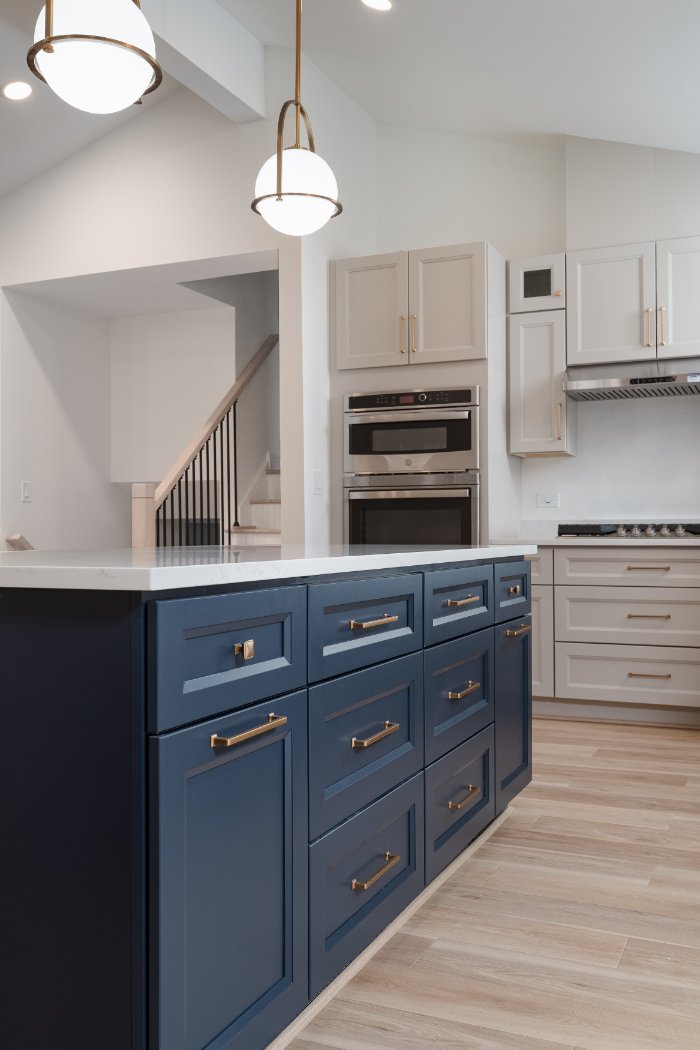 Detailed kitchen island renovation by Skor Construction in Arlington Heights, IL with deep blue cabinetry and modern brass drawe-optimized