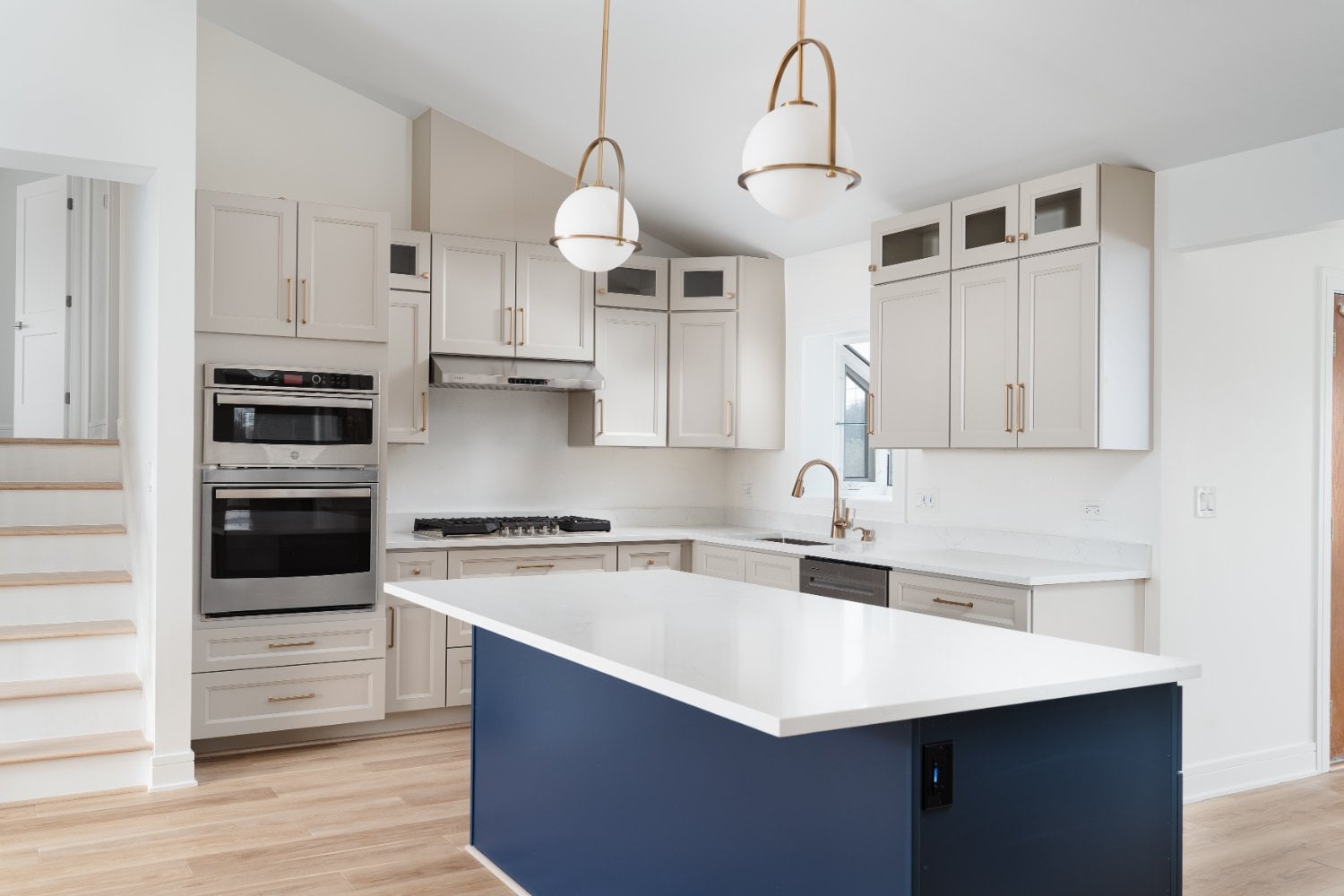 Skor Construction kitchen renovation in Arlington Heights, IL featuring custom shaker cabinetry, quartz countertops, and a large-optimized