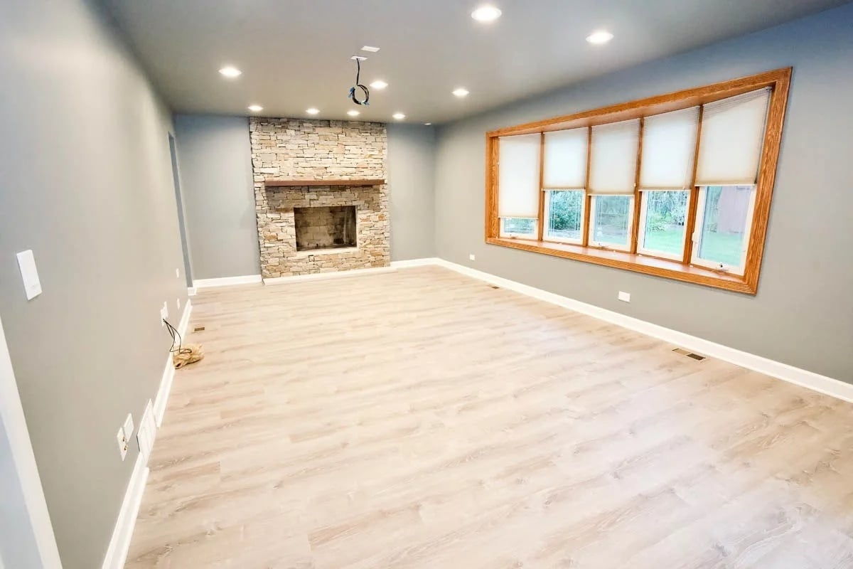 Newly-completed living room remodel with custom fireplace and mantle on Chicago's North Shore