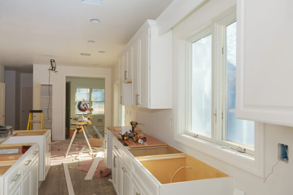 Homeowners and contractor discussing whole home remodeling project